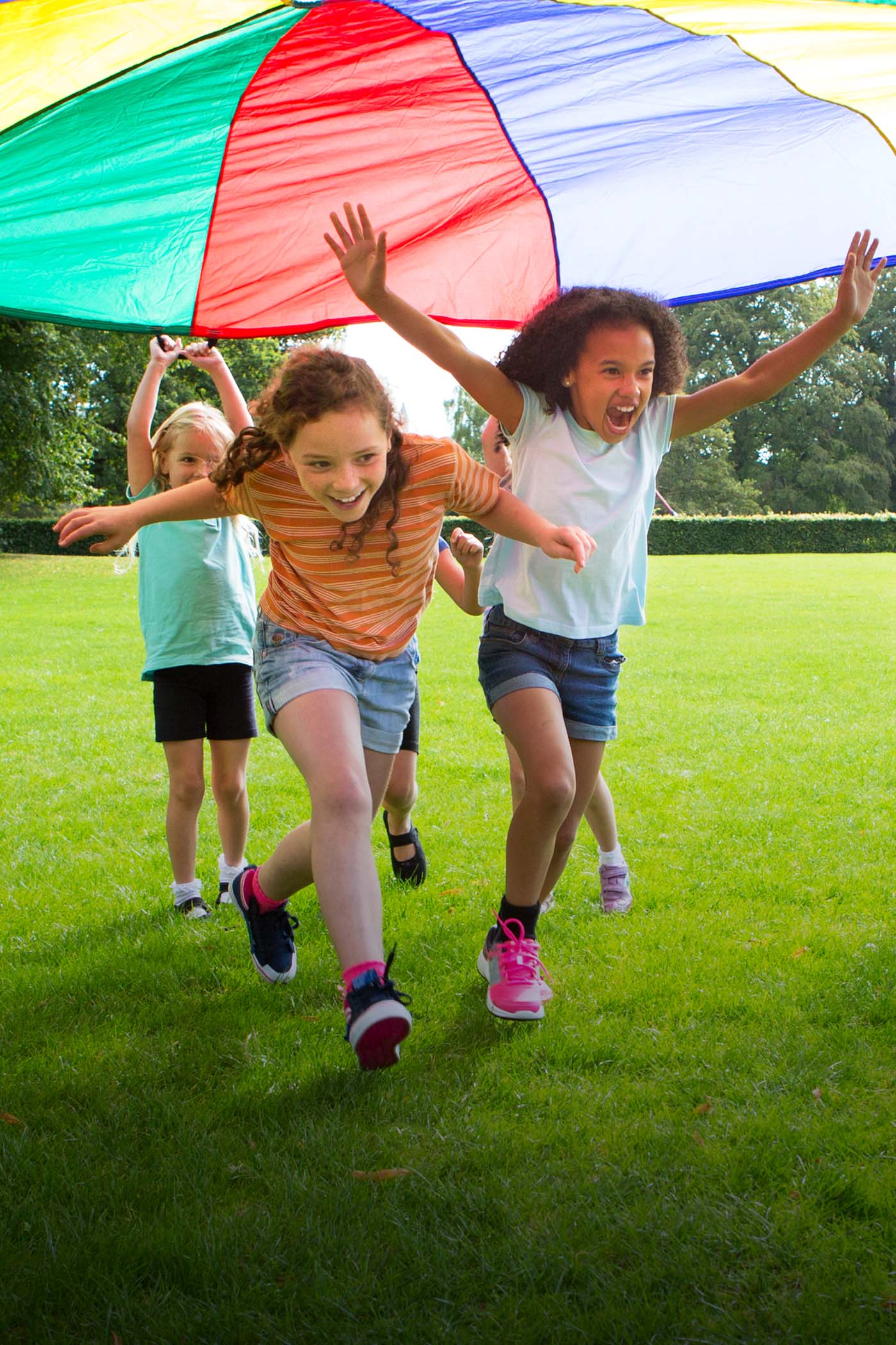 children running under fun color canopy-v2