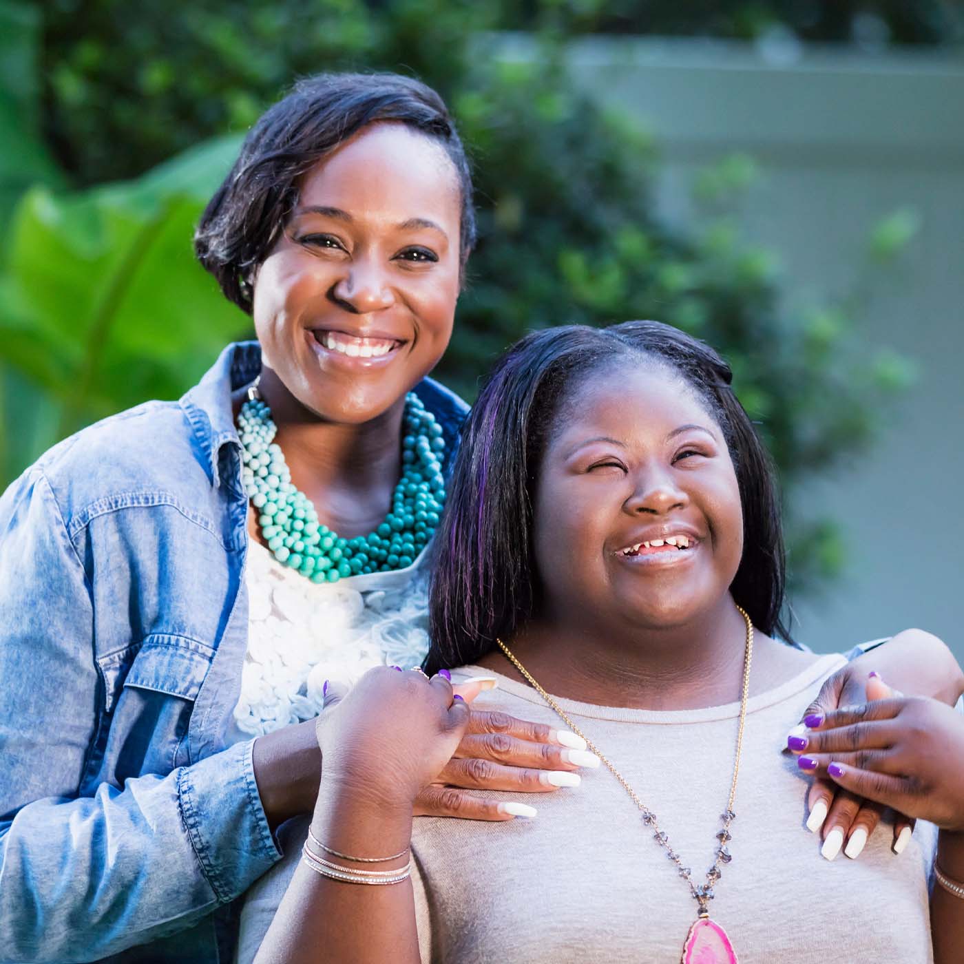 independent young lady with a developmental disability smiling with her mentor