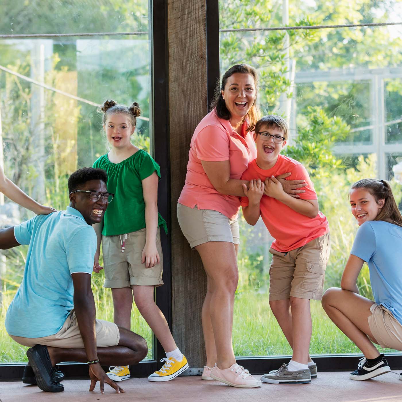 kids at a zoo smiling and having fun