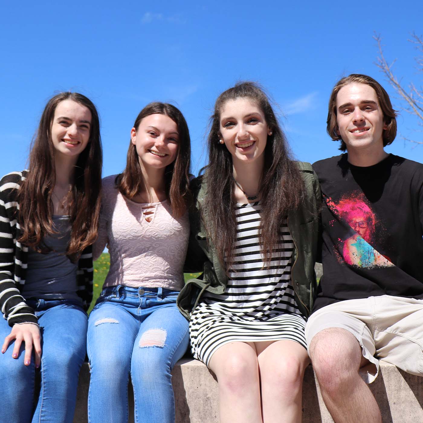 2013-three teen girls and one teen guy sitting together-square