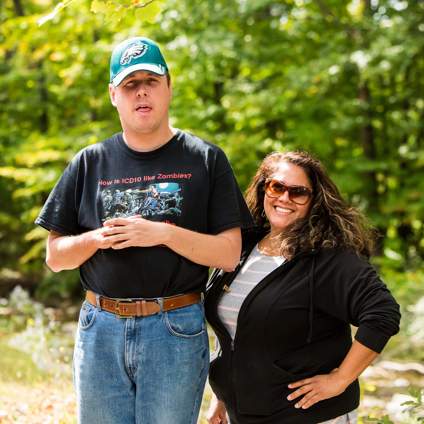 a woman who works with access services smiling with a man who has an intellecutal disability