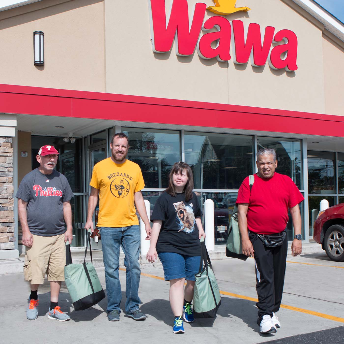 access services clients walking out of wawa with bags full of goodies