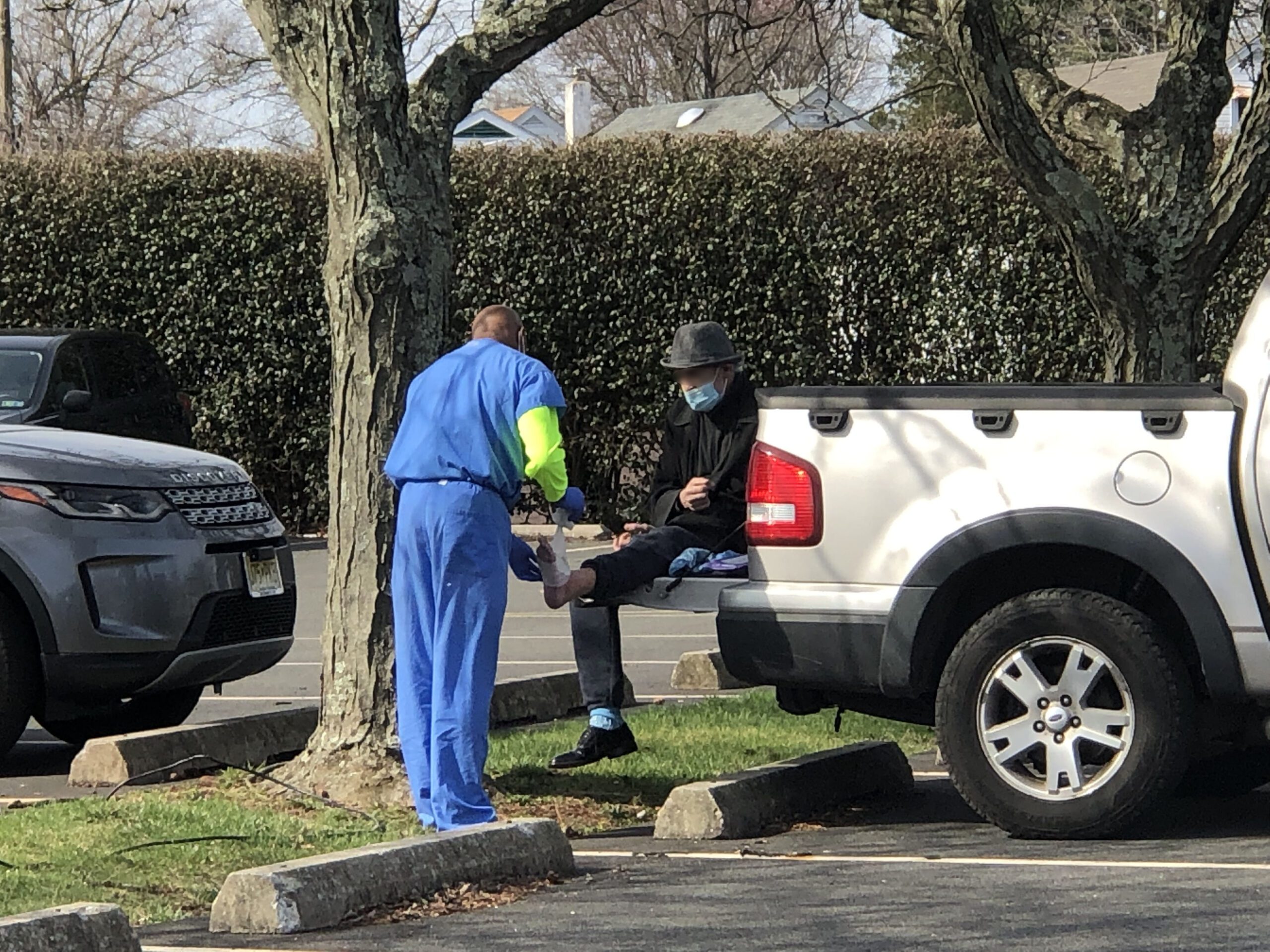 doctor helping homeless man